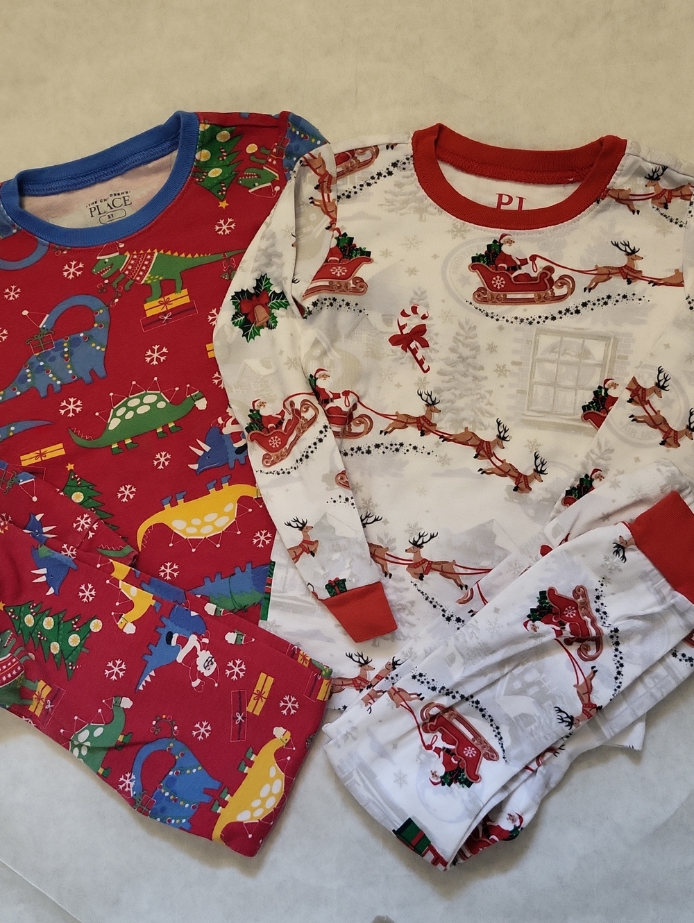 Two pair snug fitting festive pajama sets